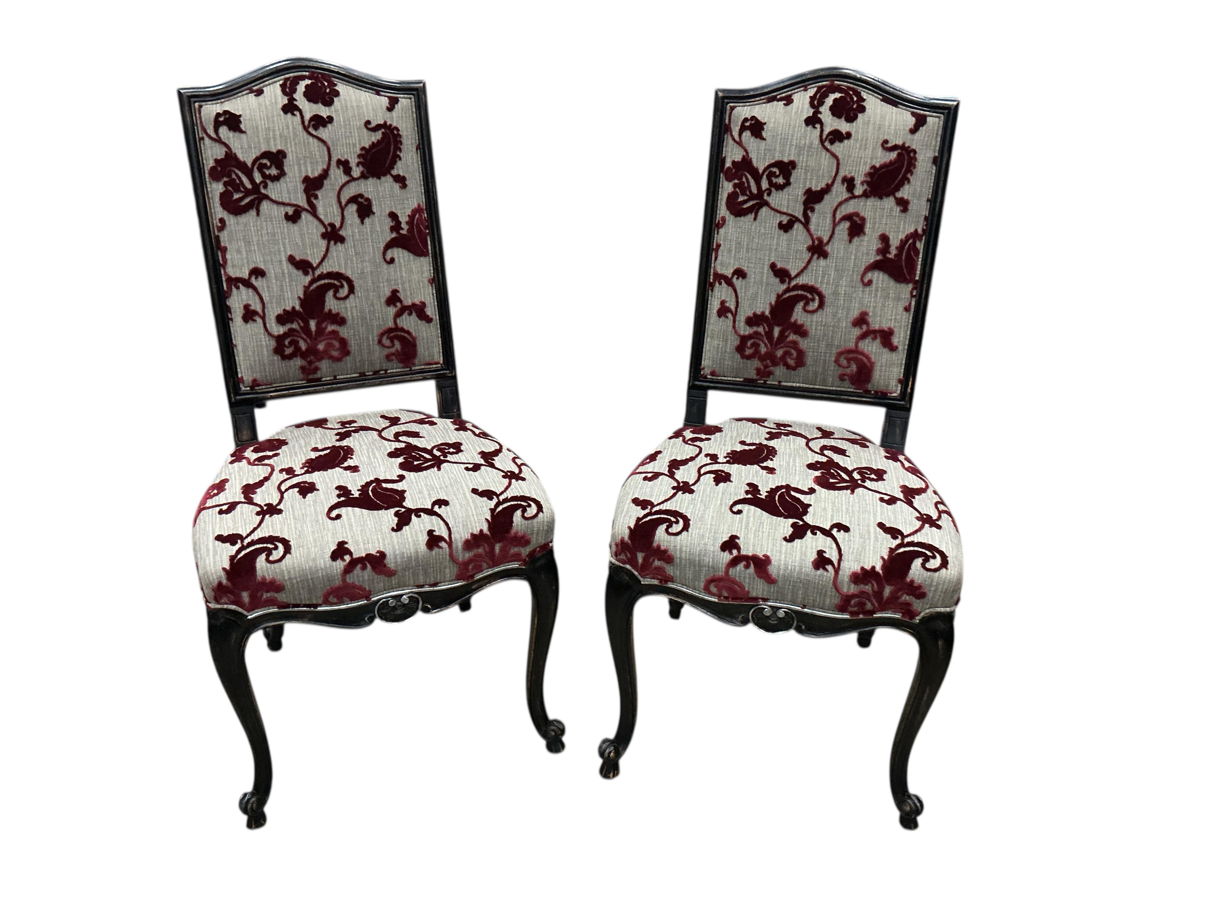 A set of eight Roche Bobois Louis XV style ebonised dining chairs, two with arms